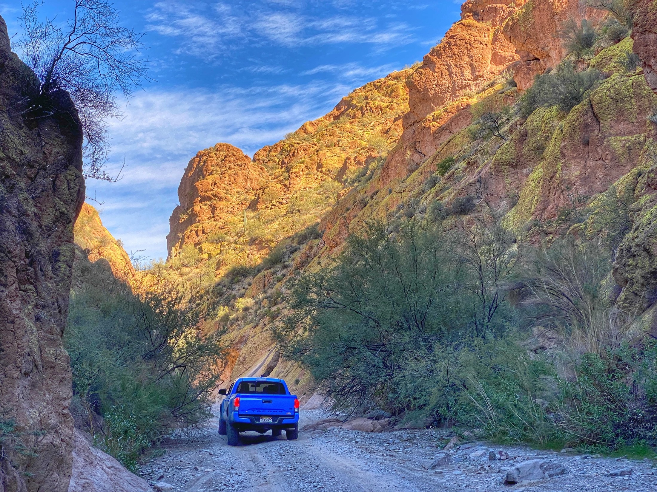 Box Canyon Adventure — Wickenburg to Yarnell (Full Day Tour)
When we say full day, we mean it. This run is a sunrise-to-sunset kind of experience that takes you through some of the wildest transitions Arizona has to offer — from the sun-baked desert floors outside Wickenburg to the cool pine country up near Yarnell.
We start in Wickenburg, where the spirit of the Old West is alive and well. Once we leave town, the blacktop ends and the real adventure begins. The trail wastes no time throwing you into the action:
Box Canyon, with its sheer rock walls and narrow squeezes, is the first test. The echoes of engines bouncing between the canyon walls remind you this isn’t your average Sunday drive. You’ll thread your way through tight passages, pick careful lines over rocky shelves, and feel that surge of adrenaline only a proper canyon crawl delivers.
From there, the trail opens up into wide desert valleys, dotted with saguaros, ocotillo, and creosote. The pace quickens, the washes get wider, and you feel that sweet mix of speed and freedom that only the open desert can give.
As we climb, the landscape changes — the saguaros thin out, the air cools, and the views stretch wider with every mile. Along the way, we pass historic mining sites that whisper stories of prospectors who once carved a living out of this unforgiving land. Rusted equipment, old shafts, and stone foundations serve as reminders that the desert has always tested the tough.
The final push into Yarnell is a highlight all its own: winding switchbacks, rocky climbs, and long views that let you see just how far you’ve come. By the time we roll into town, you’ll have climbed nearly 3,000 feet in elevation and experienced every flavor of Arizona terrain — from canyon rock crawls to mountain passes.

What to Expect on This Tour
Duration: 6–8 hours, with plenty of stops to rest, explore, and soak in the scenery.
Terrain Variety: Canyons, desert washes, open valleys, historic mining ruins, and mountain climbs — it’s the ultimate sampler platter of Arizona off-roading.
Wildlife: Keep your eyes peeled for desert bighorn sheep, mule deer, hawks, and maybe even a javelina crossing the trail.
Climate Shifts: Start in the desert heat, finish in the cool pines — you’ll feel like you traveled across states, not just counties.
Thrills & Memories: From tight canyon crawls to high-altitude vistas, this ride delivers challenge, beauty, and bragging rights in equal measure.

Why Ride With AZ Off-Road Tours?
Because we don’t just guide trails — we craft stories worth retelling. Every bump, climb, and lookout on this run becomes part of your Arizona adventure. Whether you’re after adrenaline, photography, or just a day to leave the pavement far behind, this route gives you everything in one epic package.
From Wickenburg’s desert dust to Yarnell’s mountain air — this is the Arizona off-road tour you’ll talk about for years.